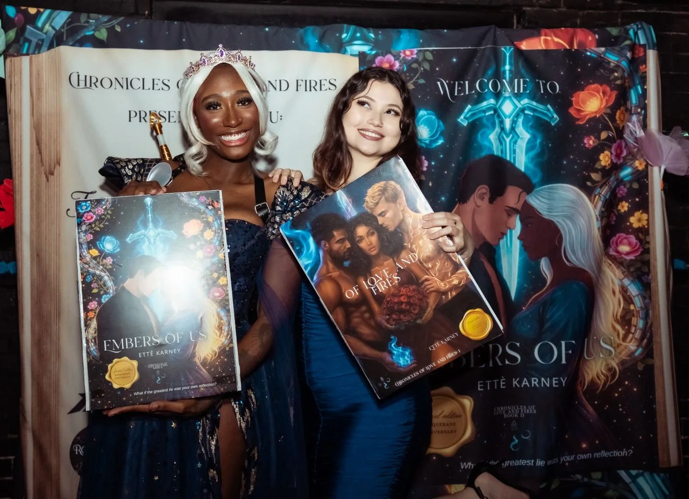 Guests holding Chronicles books at Touched by Fire